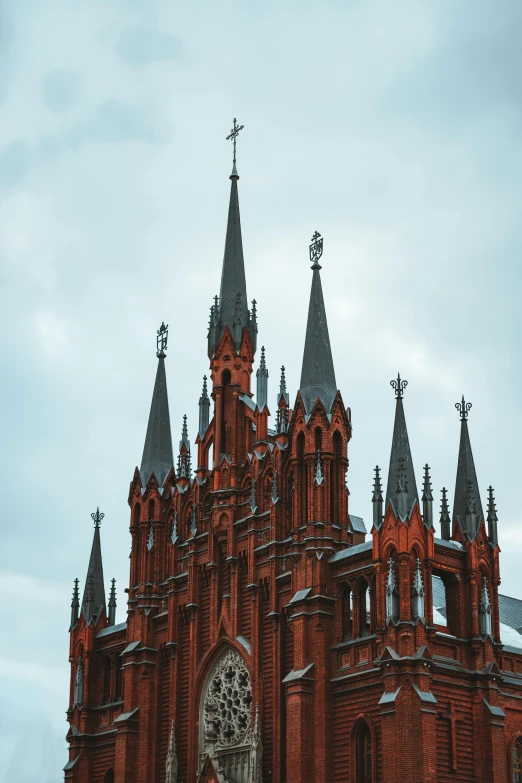 a very tall building with a clock on it's side, pexels contest winner, international gothic, red fluid on walls of the church, black domes and spires, russian architecture, spines