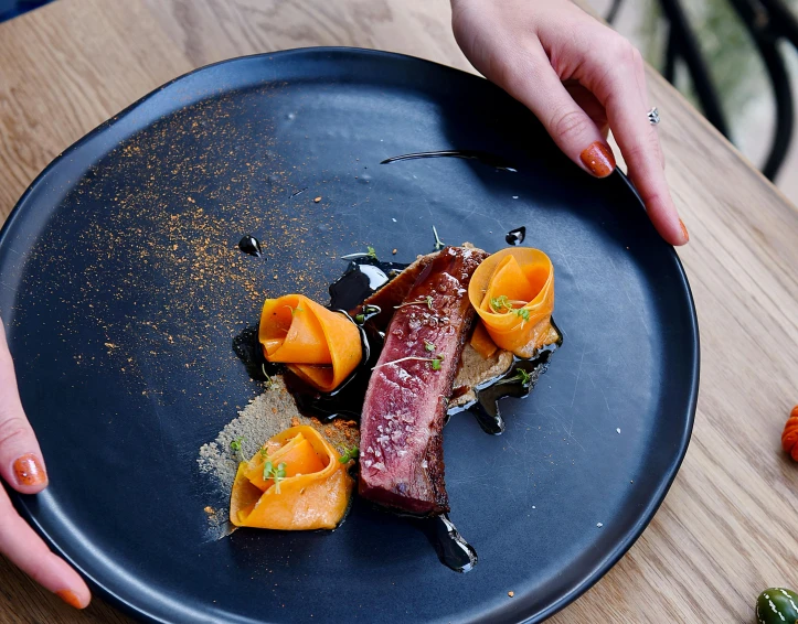 a close up of a plate of food on a table, a picture, inspired by Charles Le Roux, pexels contest winner, dark blue + dark orange, hanging beef carcasses, in chippendale sydney, birds eye