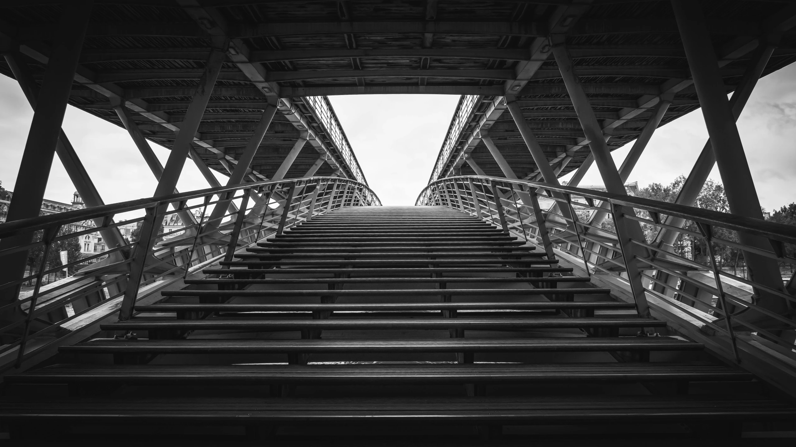 a black and white photo of a bridge, a black and white photo, by Raphaël Collin, unsplash contest winner, constructivism, stairs from hell to heaven, low angle!!!!, in paris, parametric structure