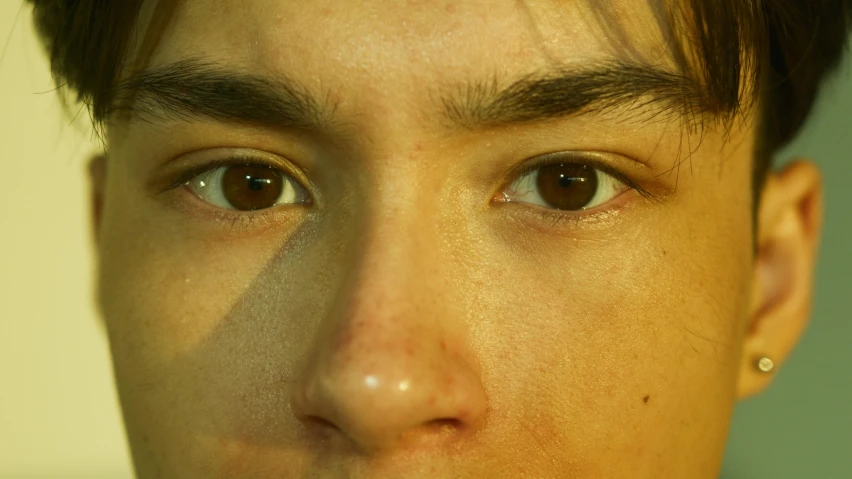 a close up of a person with a tie on, pexels contest winner, hyperrealism, light brown piercing eyes, androgynous face, taken in the late 2000s, dark brown eyes with long