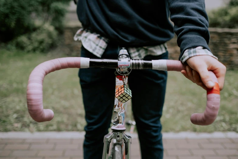 a close up of a person riding a bike, pexels contest winner, college, background image, coloured photo, closeup of arms
