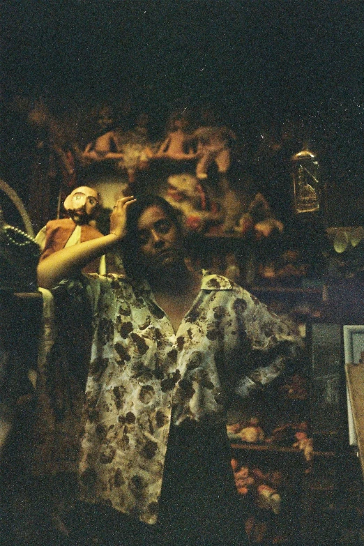 a man that is standing in a room, an album cover, inspired by Elsa Bleda, unsplash, renaissance, grainy photo of an ugly woman, inside an old magical shop, clothed.1990s, toy camera