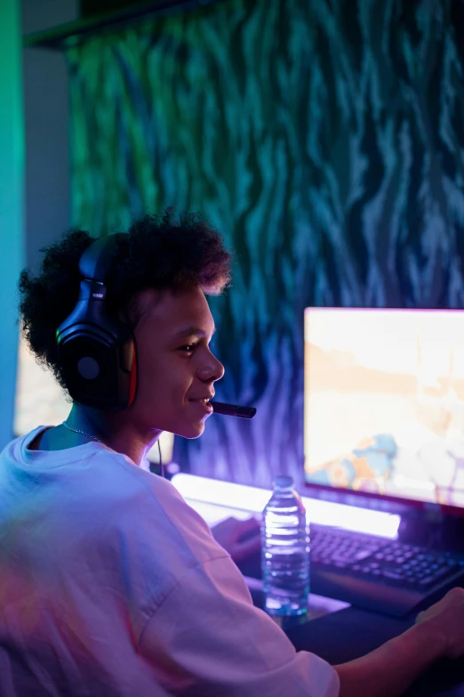 a woman sitting in front of a computer with headphones on, tournament, black teenage boy, vibrant aesthetic, 64x64