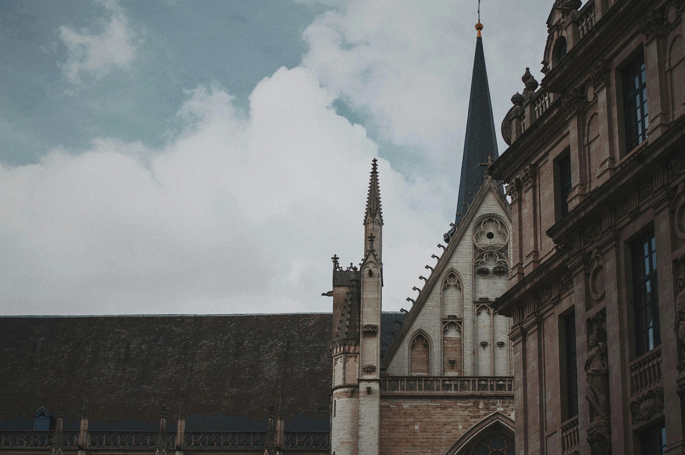 a couple of people that are standing in front of a building, by Daniel Seghers, pexels contest winner, renaissance, gothic church background, background image, asymmetrical spires, viewed from the ground