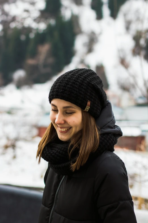 a woman in a black jacket and a black hat, by Adam Marczyński, pexels contest winner, wearing beanie, square, bosnian, engineered