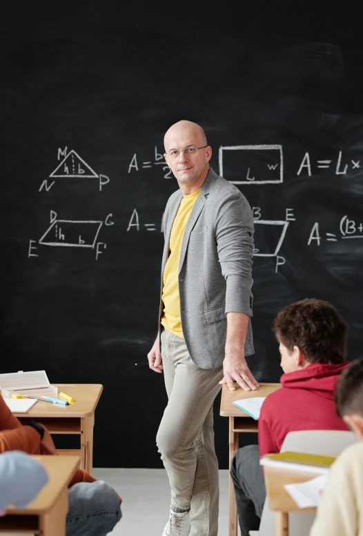 a man standing in front of a blackboard in a classroom, square, doug walker, 15081959 21121991 01012000 4k, promotional image