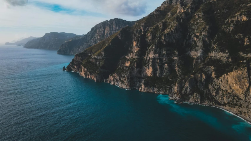 a large body of water next to a cliff, pexels contest winner, les nabis, mediterranean, fan favorite, ultrawide cinematic, high res 8k