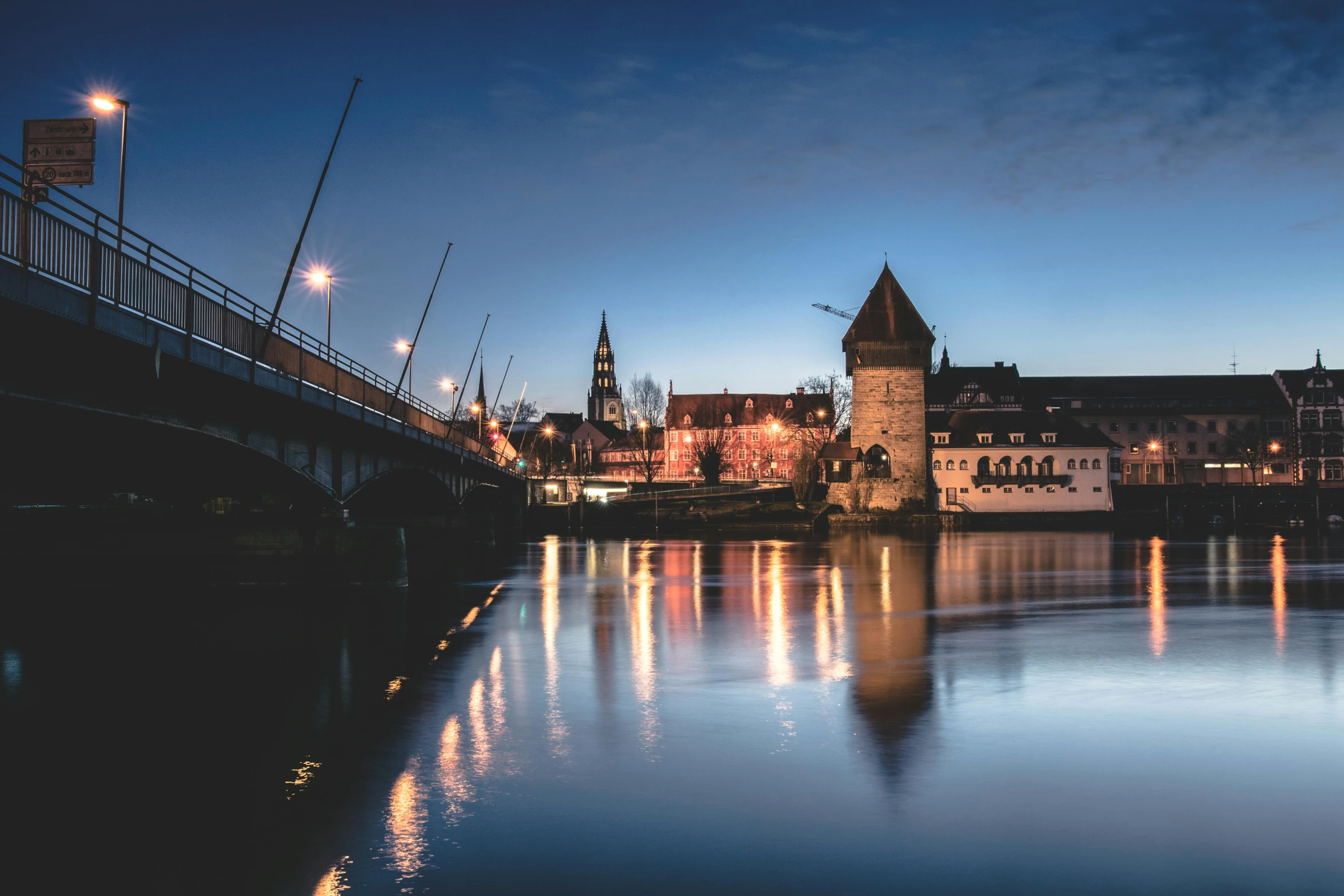 a bridge over a body of water with a castle in the background, by Thomas Häfner, pexels contest winner, twilight in the city, nuremberg, hasselblad photography, river stour in canterbury