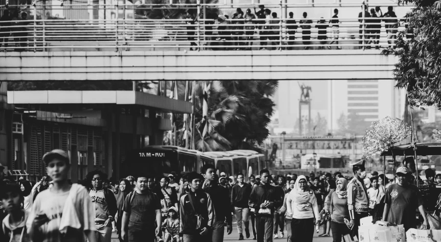 a black and white photo of a crowd of people, a black and white photo, pexels, talaat harb square cairo, on a bridge, california;, fashionable