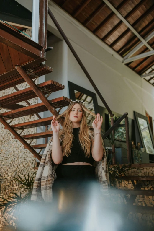 a woman sitting at a table with her hands in the air, a portrait, inspired by Elsa Bleda, pexels contest winner, light and space, sitting on temple stairs, cottagecore hippie, sydney sweeney, meditating in lotus position