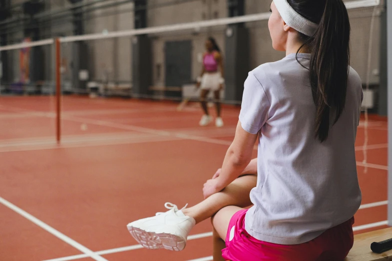 a woman sitting on a bench with a tennis racket, local gym, profile image, badminton, thumbnail