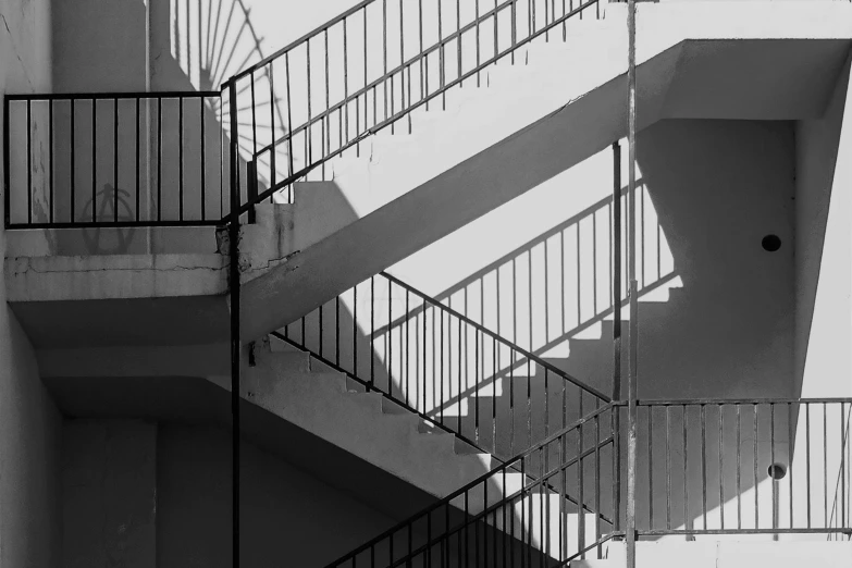 a black and white photo of a set of stairs, a black and white photo, pexels contest winner, brutalism, realistic light and shadow, ( ( railings ) ), complex layered composition!!, 4k greyscale hd photography