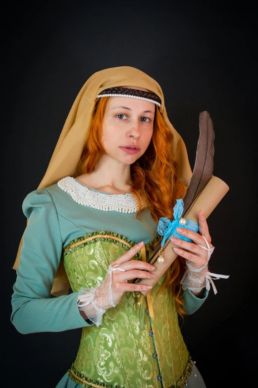 a woman in a green dress holding a feather, a character portrait, inspired by Jean-Étienne Liotard, renaissance, full-cosplay, female redhead templar, and