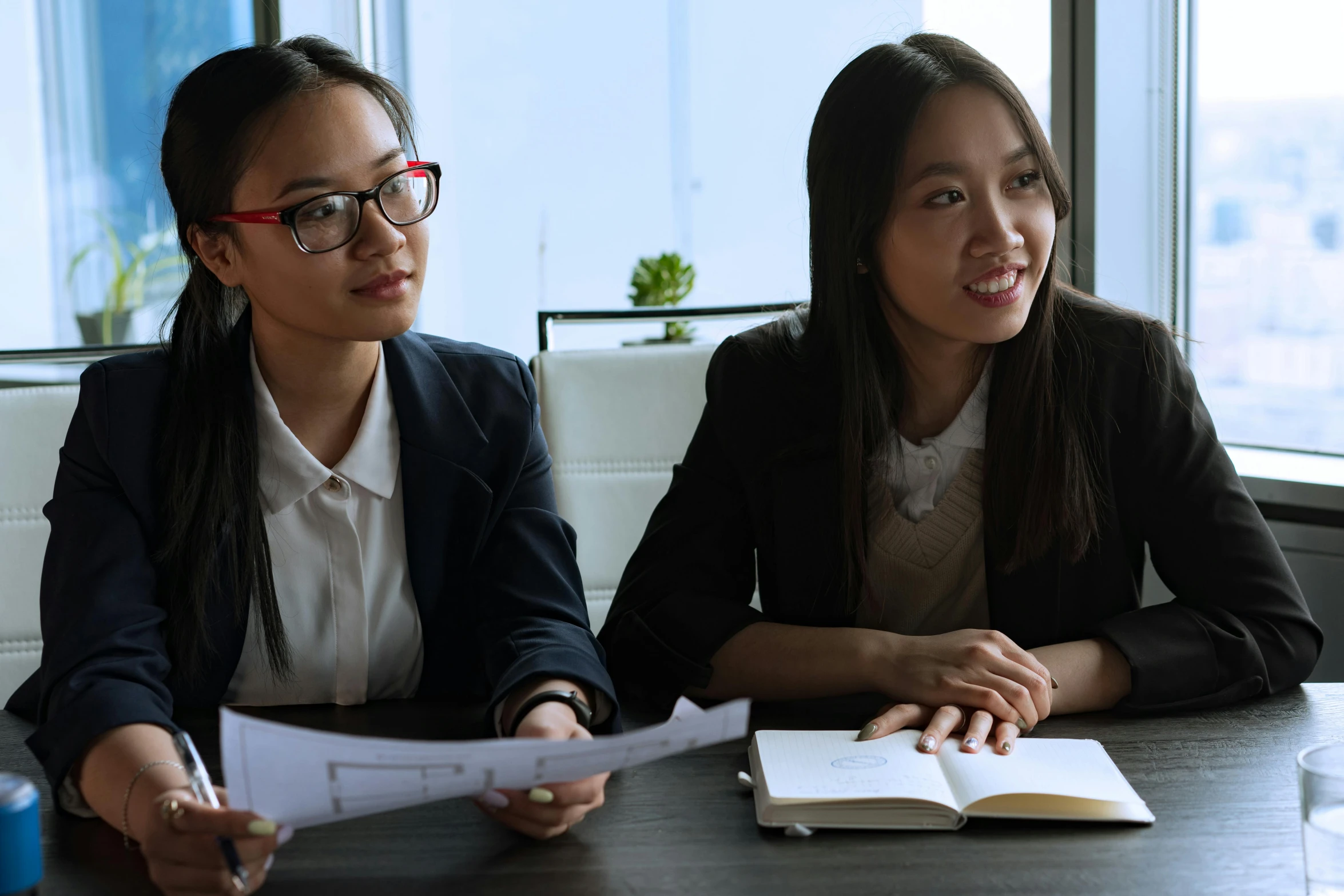 a couple of women sitting next to each other at a table, pexels contest winner, wearing business casual dress, asian features, avatar image, professional closeup photo