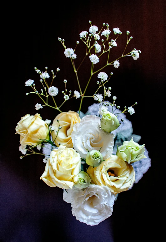 a vase filled with white and yellow flowers, romanticism, opalescent mist, abstract smokey roses, centerpiece, comfort