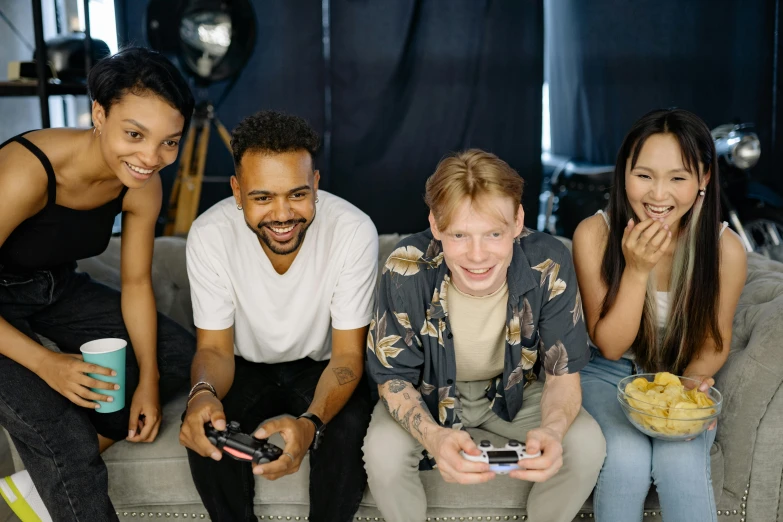 a group of people sitting on top of a couch, videogames, smiling at the camera, avatar image, trending photo