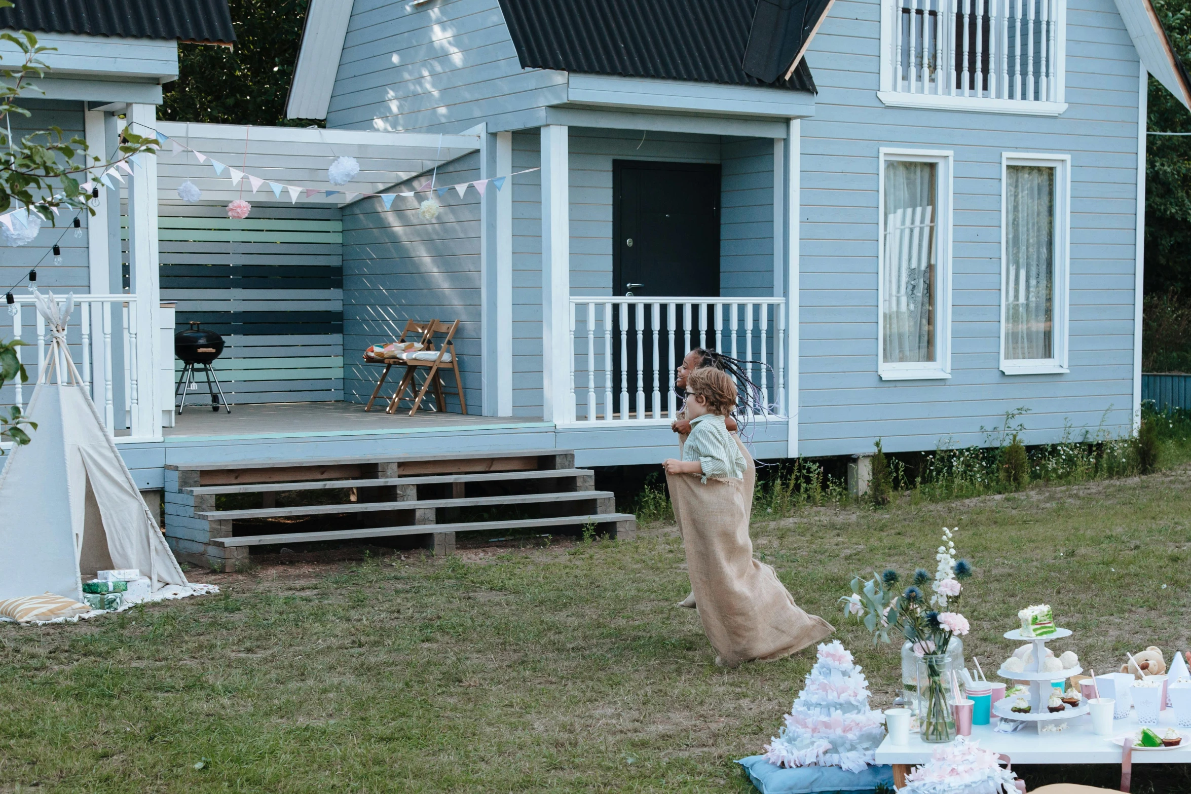 a woman standing in front of a blue house, by Jaakko Mattila, unsplash, happening, at a birthday party, people on a picnic, 15081959 21121991 01012000 4k, bubbly