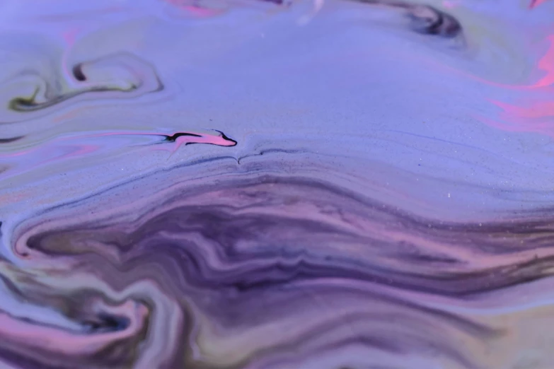 a close up of a liquid substance on a surface, inspired by Julian Schnabel, unsplash, violet planet, music video, ethereal eel, multicoloured