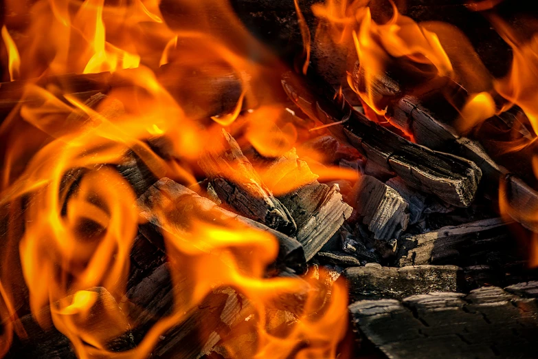 a pile of wood sitting on top of a fire, by Daniel Lieske, pexels contest winner, avatar image, dynamic closeup, flame colors bright, thumbnail