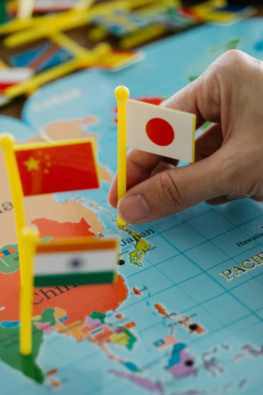 a person placing flags on a map of the world, incoherents, japanese collection product, slide show, toys, india