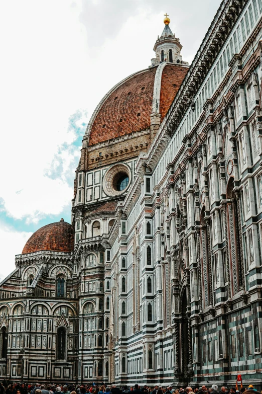 a group of people standing in front of a tall building, inspired by Michelangelo Buonarotti, pexels contest winner, renaissance, with great domes and arches, gif, exterior view, blooming