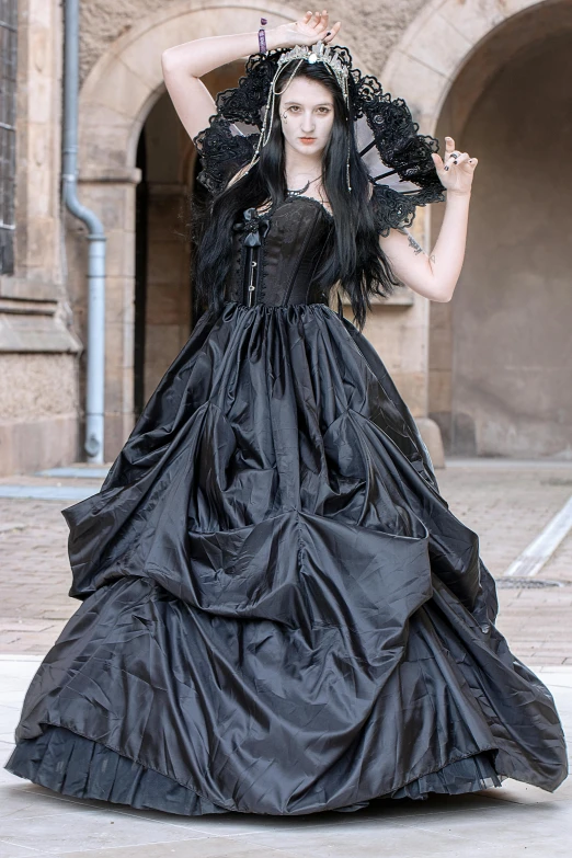 a woman in a black dress posing for a picture, inspired by Anne Stokes, flickr, baroque, 15081959 21121991 01012000 4k, long windblown black hair, expensive voluminous dress, cosplay