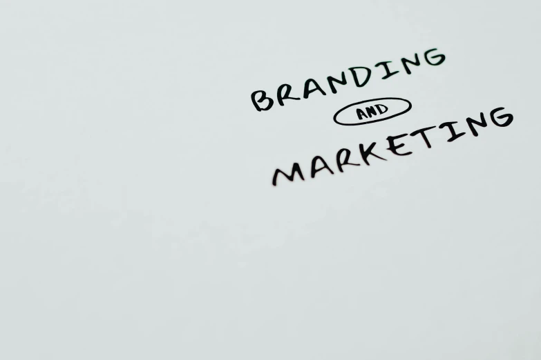 a piece of paper with the words branding and marketing written on it, trending on pexels, photograph 3 5 mm, markets, cartoon image, permanent marker