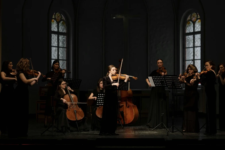 a group of people playing musical instruments on a stage, inspired by Anna Füssli, baroque, scene set in a church, violin, lit from the side, group of seven