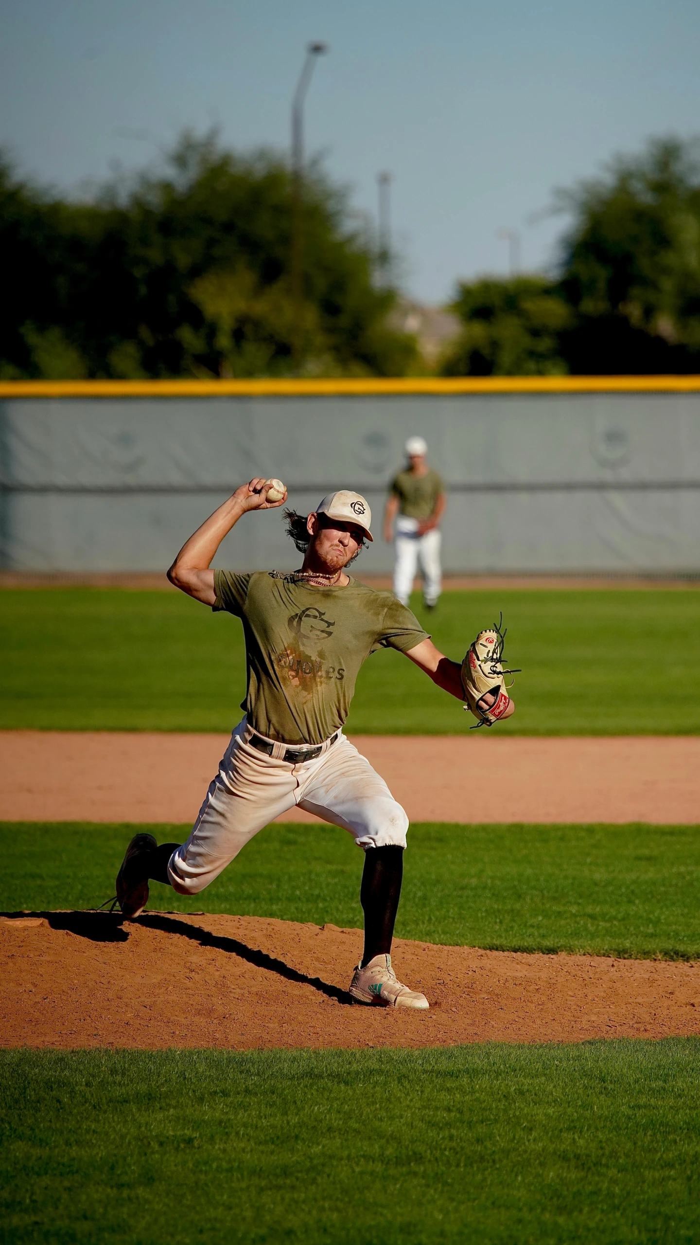 a man pitching a baseball on top of a field, by Gavin Nolan, full body image, high quality photo, thumbnail, militaristic