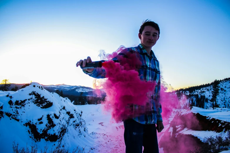 a man standing on top of a snow covered slope, an album cover, pexels contest winner, graffiti, pink smoke, connor hibbs, paint pour smoke, photo from a promo shoot