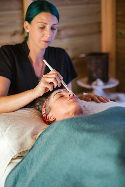 a woman getting a facial massage at a spa, by Jessie Algie, process art, snow monkeys at the mountain spa, thumbnail, white lashes, brown