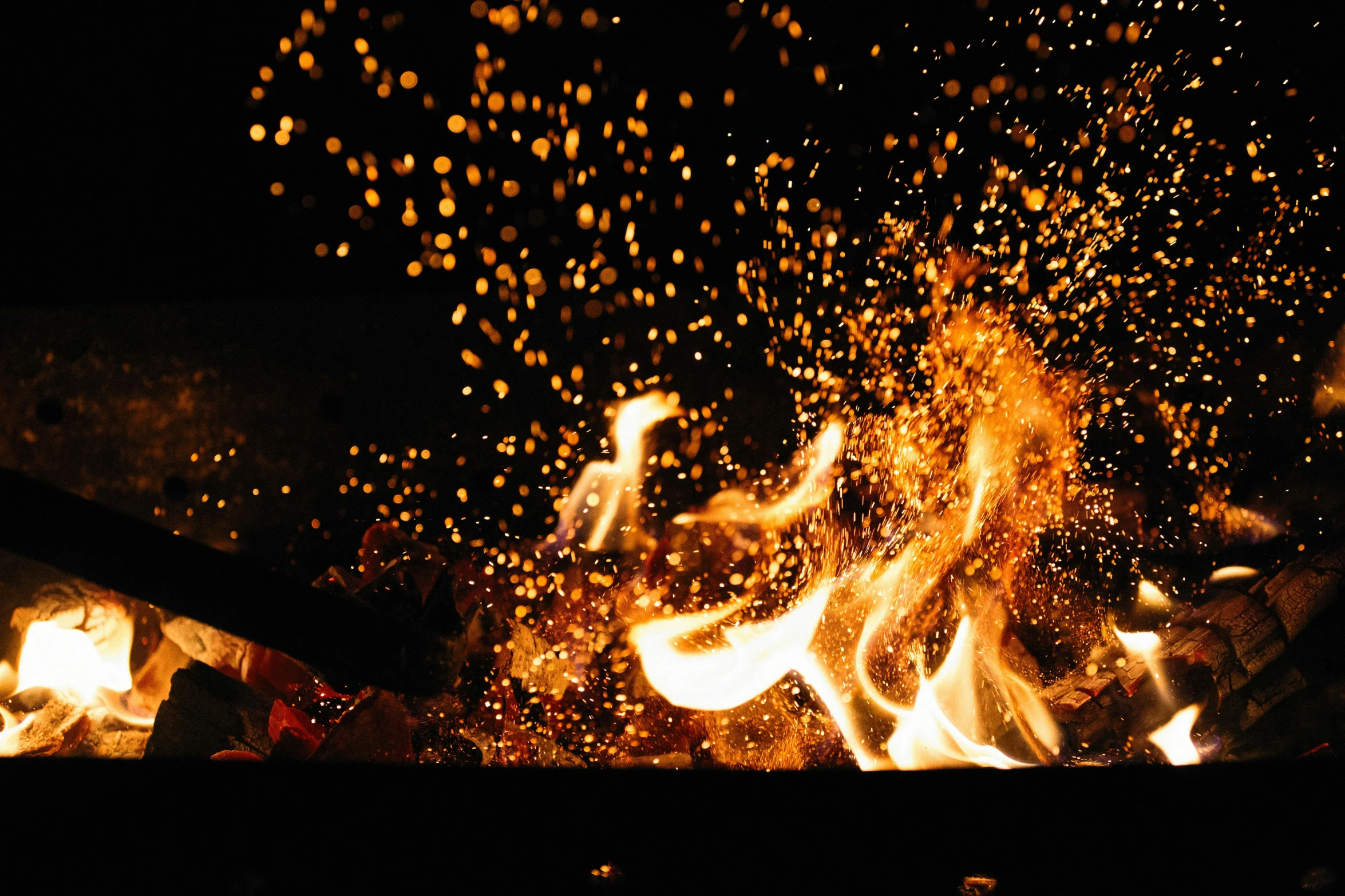 a close up of a fire with sparks coming out of it, pexels contest winner, thumbnail, profile image, media photo, irori fireplace