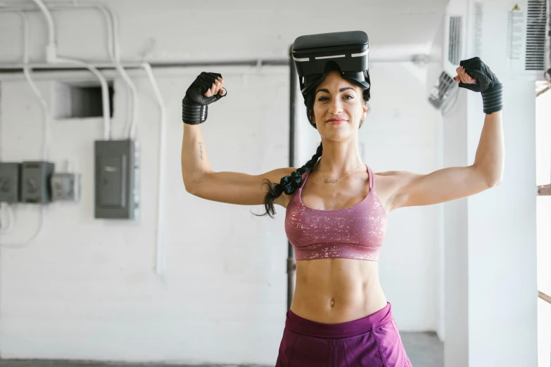 a woman holding a pair of boxing gloves on her head, pexels contest winner, using a exoskeleton, training bra, avatar image, half body photo