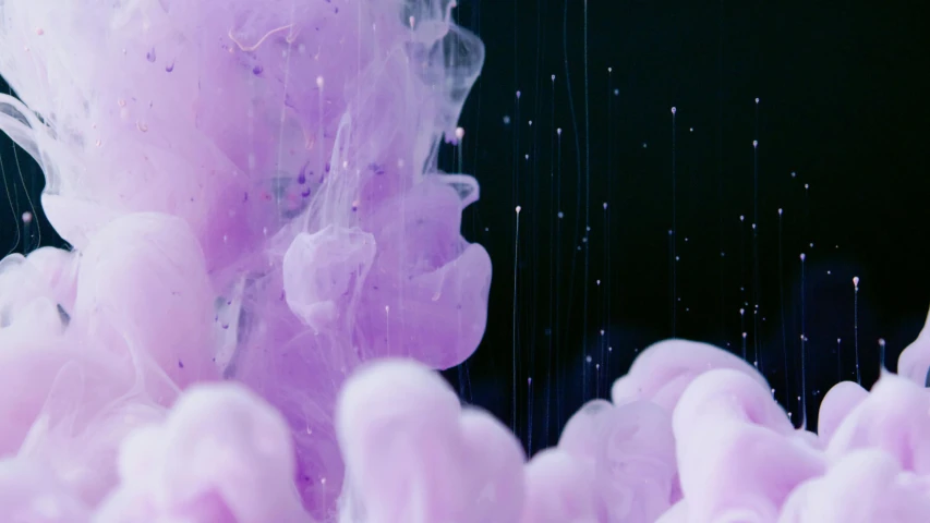 a close up of a pink substance in water, inspired by Kim Keever, trending on pexels, purple, space jellyfish, in a cloud, teamlab