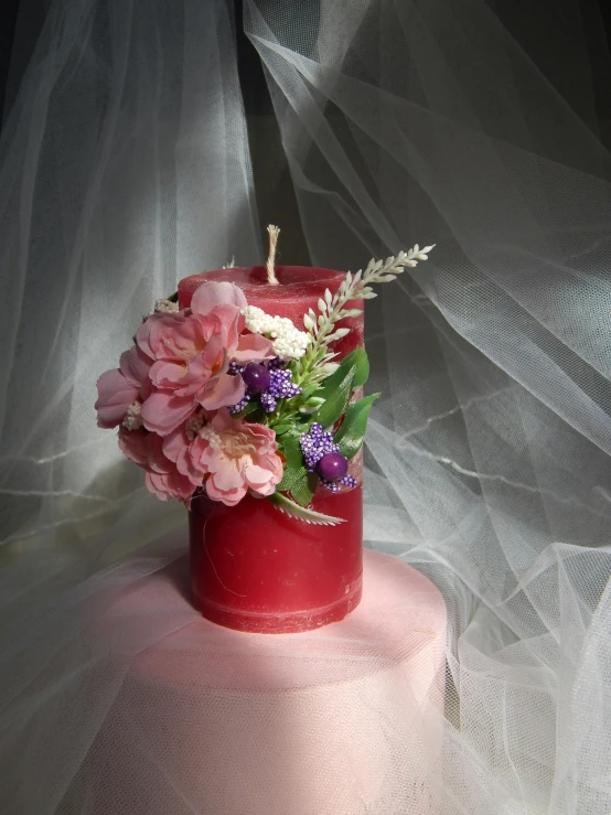 a red candle sitting on top of a pink cake, made of dried flowers, singularity sculpted �ー etsy, medium, ethereal lighting - h 640