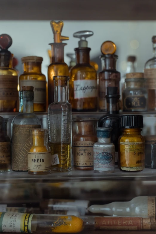 a bunch of bottles sitting on top of a shelf, a portrait, unsplash, renaissance, medical labels, amber, ignant, formulas