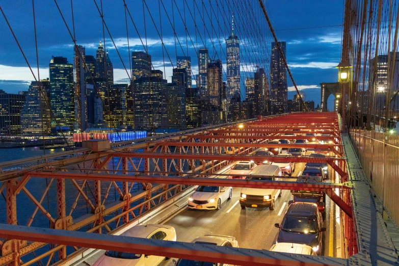 a view of a city from the top of a bridge, inspired by Thomas Struth, car traffic, in the evening, brooklyn background, promo image