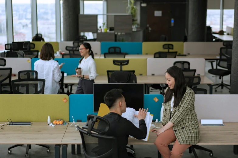 a couple of people sitting at desks in an office, by Jang Seung-eop, pexels contest winner, avatar image, in a open-space working space, neo kyiv, mongolia