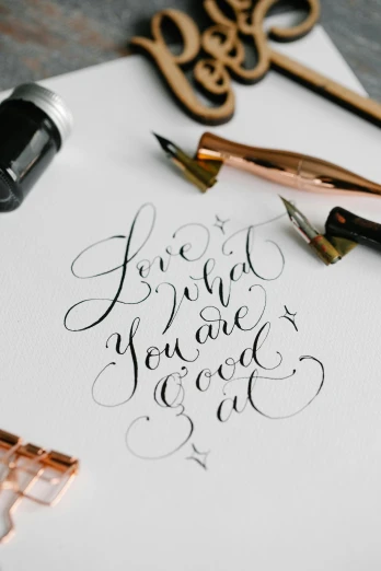 a piece of paper with writing on it, an ink drawing, by Lucette Barker, unsplash, letterism, calligraphy formula, love craft, tools, behance lemanoosh