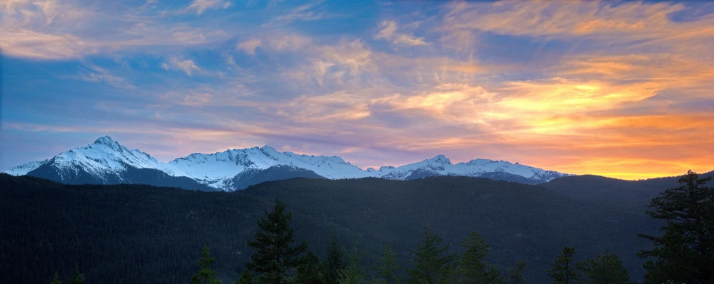 a view of a mountain range at sunset, by Jessie Algie, pexels contest winner, whistler, panorama, fan favorite, conde nast traveler photo