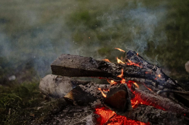 a close up of a fire with smoke coming out of it, pexels contest winner, figuration libre, outdoor campfire pit, background image, a wooden, profile image