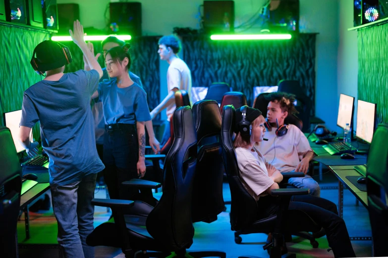 a group of people playing a video game, chairs, cinematic colors lighting, instagram post, low iso