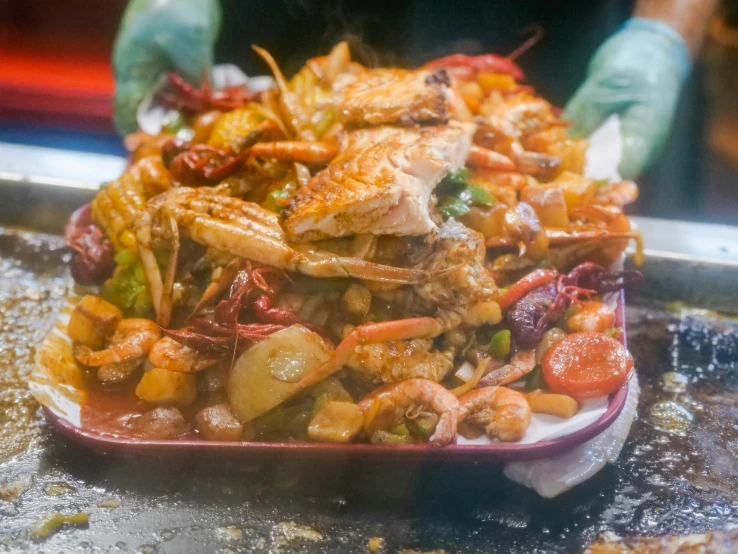 a close up of a tray of food on a table, by Joe Bowler, pichacu cooks a squid, mess, spicy, thumbnail