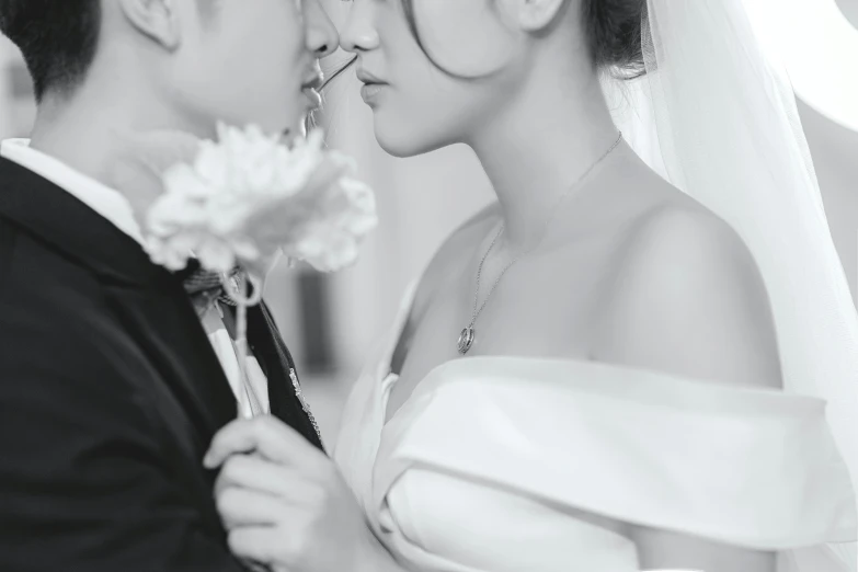 a black and white photo of a bride and groom, a black and white photo, by Ke Jiusi, pexels contest winner, romanticism, chinese woman, digitally enhanced, holding close, today\'s featured photograph 4k