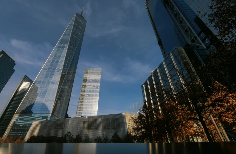 a group of tall buildings next to a body of water, a picture, 9/11, fan favorite, gopro photo, low-angle