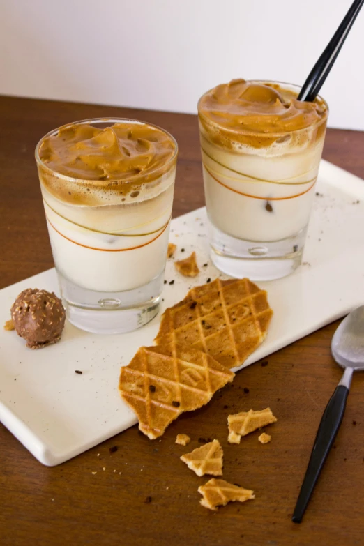 a couple of glasses sitting on top of a table, caramel, ice cream on the side, square, thumbnail