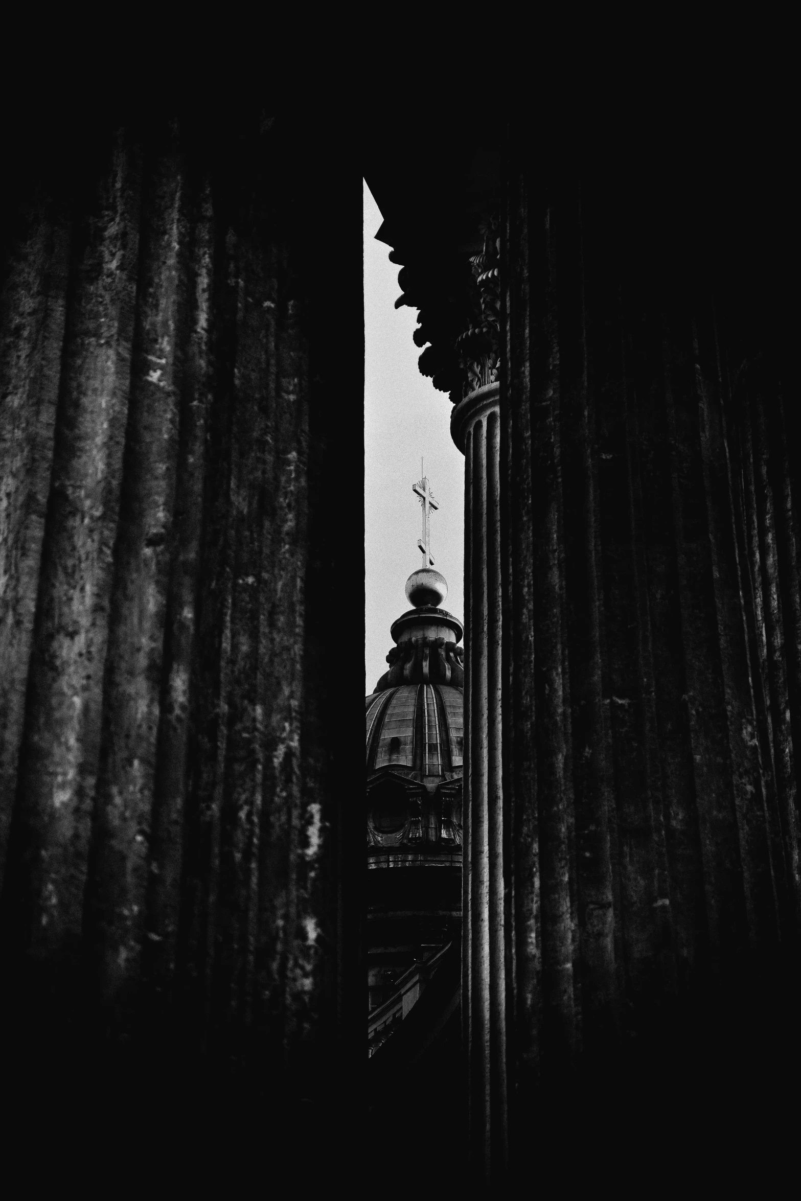 a black and white photo of a clock tower, a black and white photo, by Tobias Stimmer, unsplash contest winner, baroque, pantheon, view from behind, alessio albi, colonnade