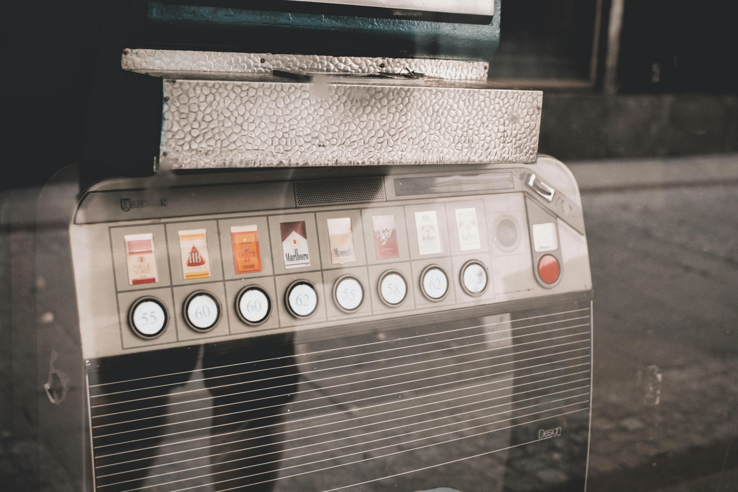 a close up of a machine on a street, an album cover, trending on pexels, hyperrealism, vending machine, background image, vintage film stock, 2 0 0 0's photo