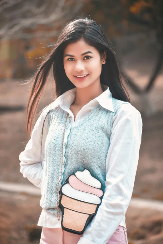 a beautiful young woman holding a pink purse, a colorized photo, inspired by Lilia Alvarado, trending on pexels, gemma chan girl portrait, light blue and white tones, cute slightly nerdy smile, food