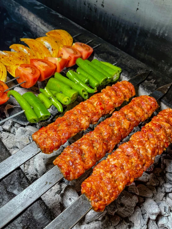 several skewers of meat and vegetables cooking on a grill, by Abdullah Gërguri, dau-al-set, 6 pack, thumbnail, paprika, food